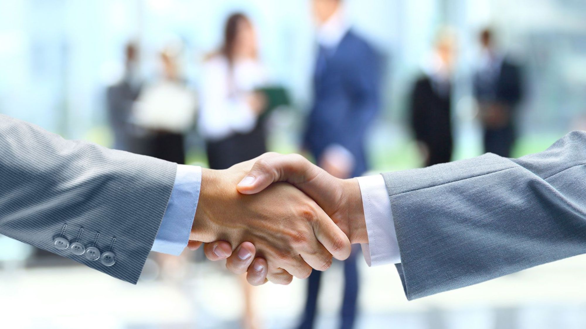 Two businessmen shaking hands to boost client engagement in a perfect business